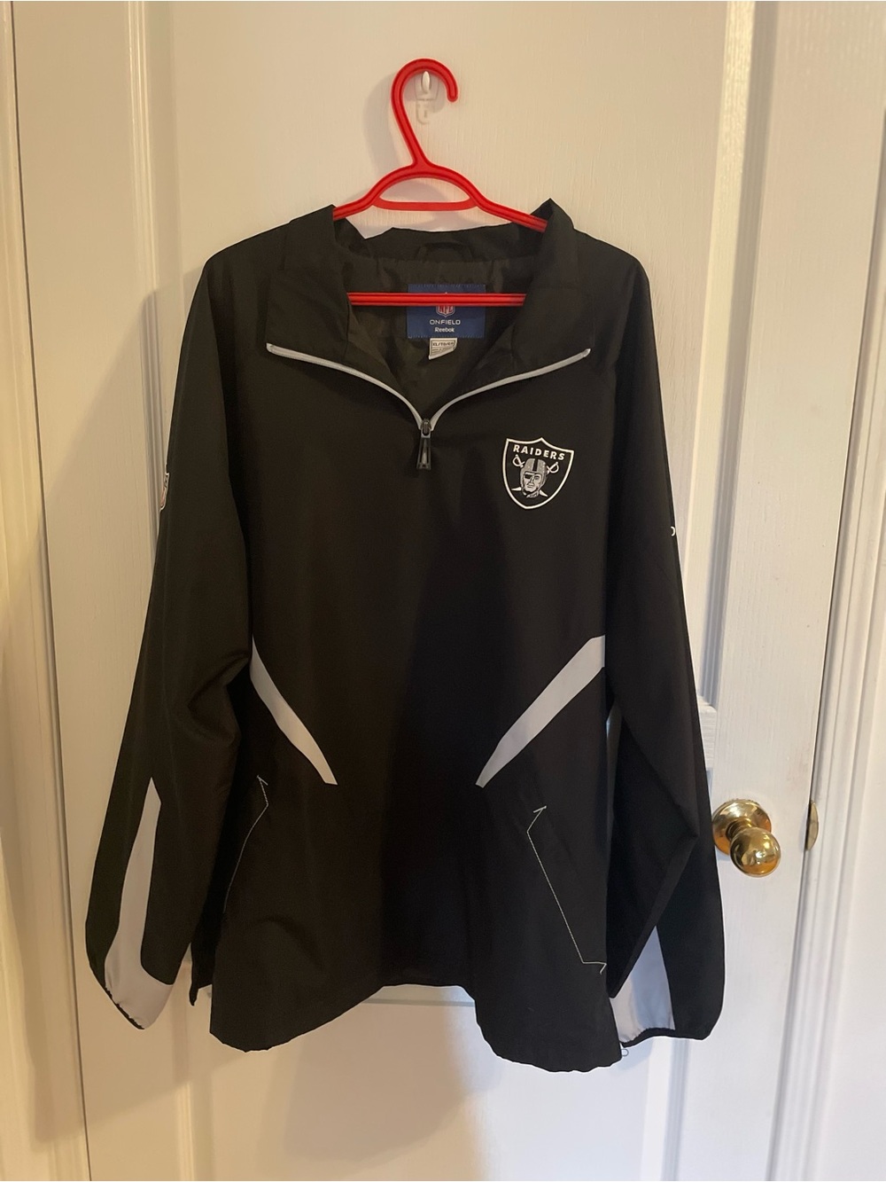 Reebok Black Jacket with Navy Label and Red Hanger Accent